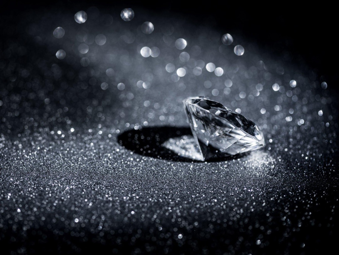 sparkling diamond in a black surface